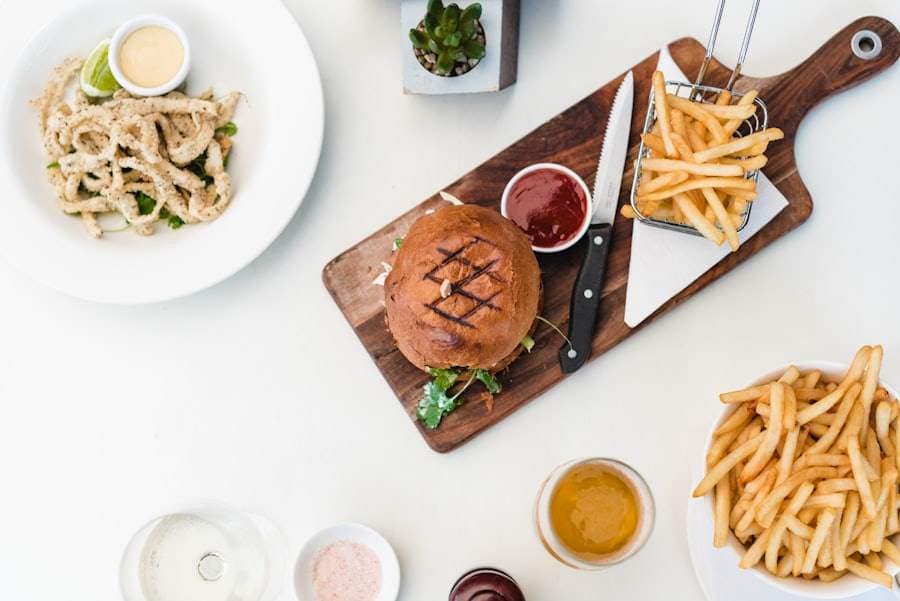 A burger, fries and calamari laid out on a table